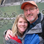 couple in front of rustic door